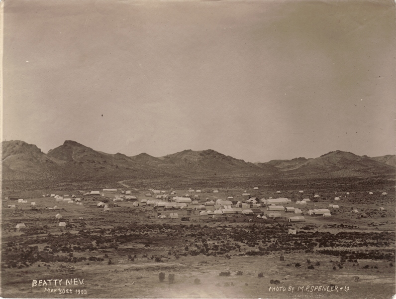 The 1905 tent town of Beatty spread across the valley floor below bare desert hills